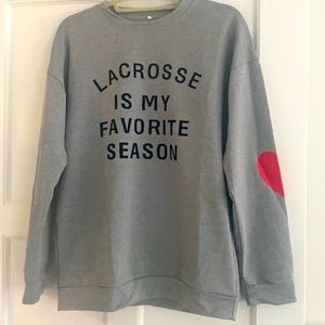 Lacrosse sweatshirt with heart detail on the sleeve